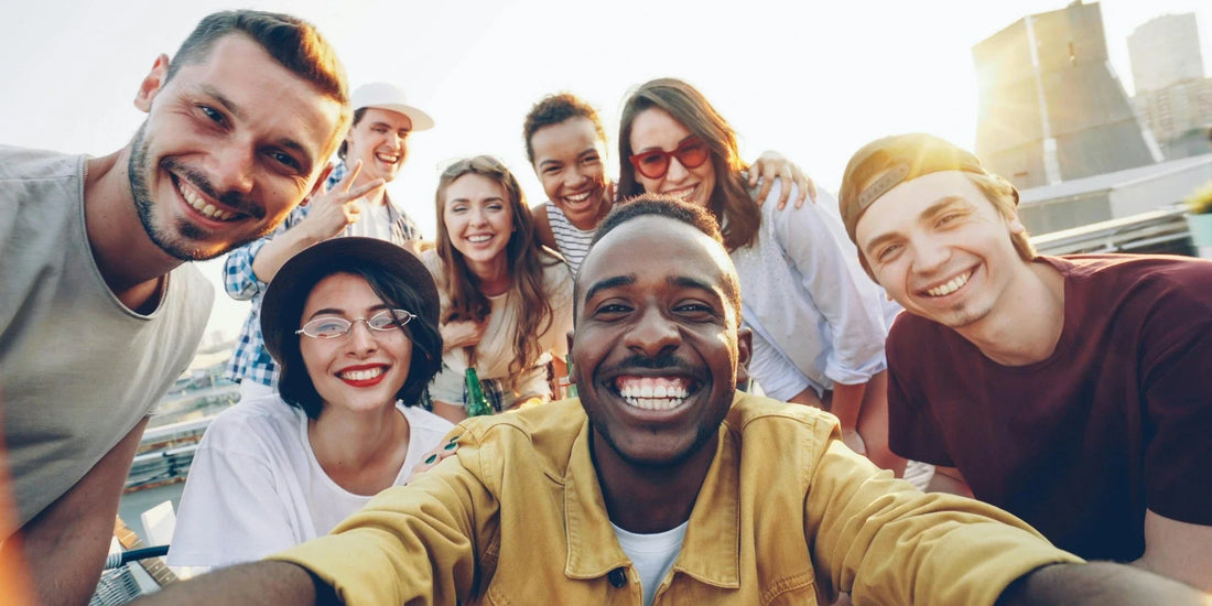 A group of people smiling outside