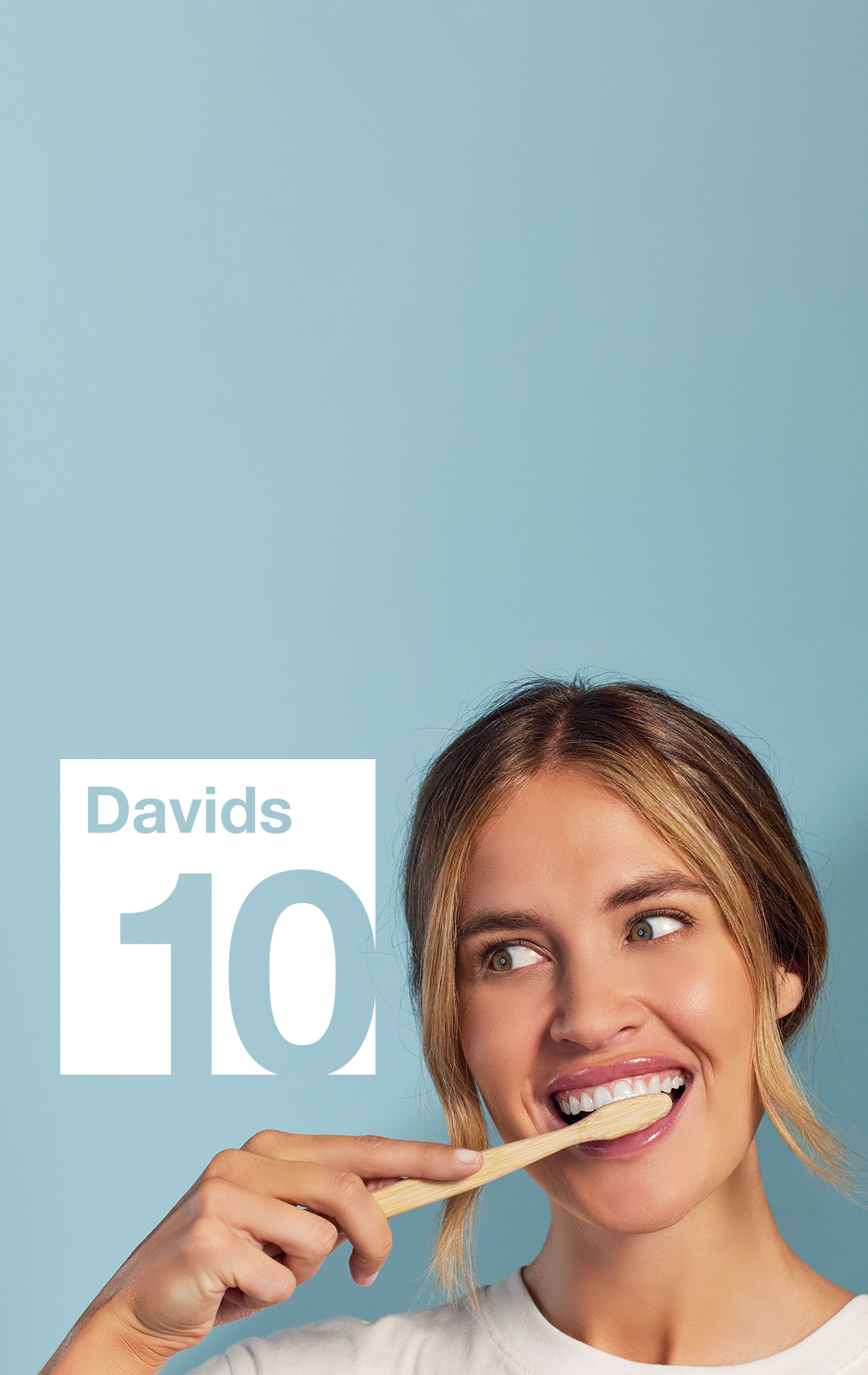 Davids 10 year anniversary logo with woman smiling and brushing using Davids toothpaste