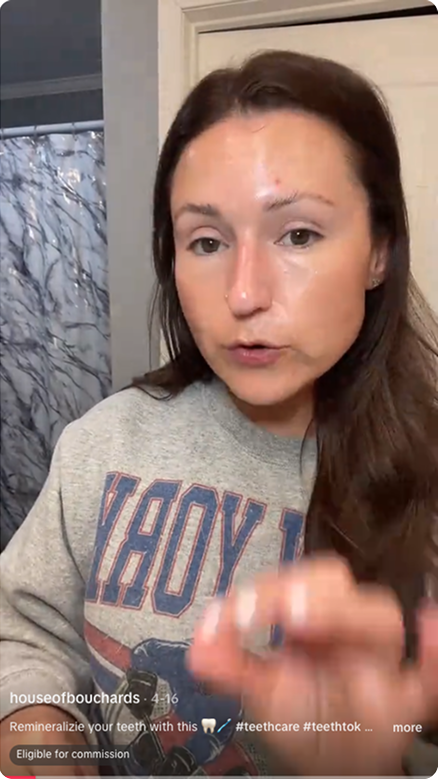 screenshot of TikTok influencer@houseofbouchards holding up Davids toothpaste and accompanying bamboo toothbrush