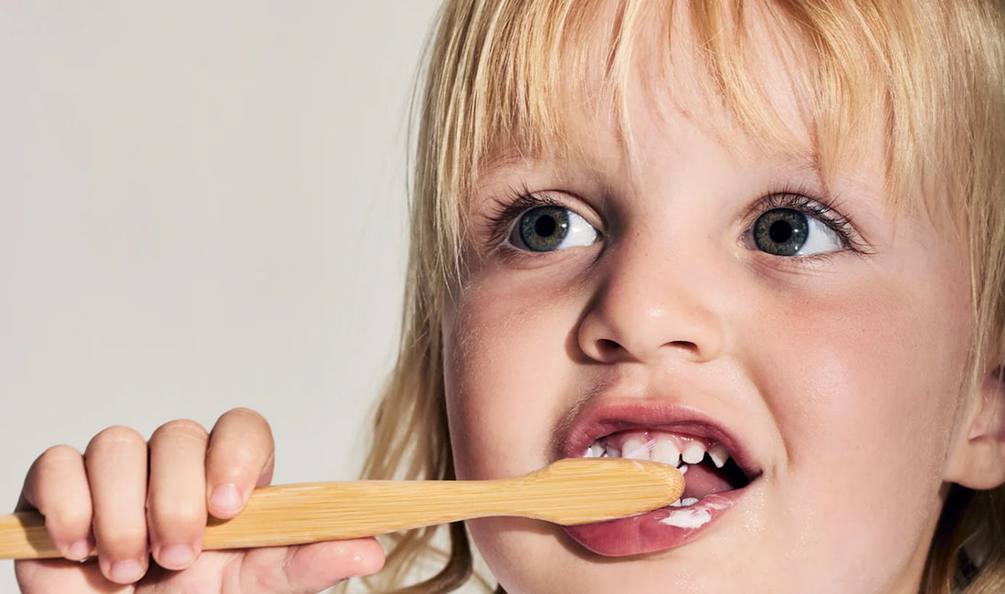child brushing teeth